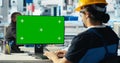 Photovoltaics factory engineer using green screen PC to adjust system parameters Royalty Free Stock Photo