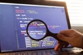 PHP back-end code zoomed through a magnifier. Computer programming source code lookup. Abstract screen of web developer Royalty Free Stock Photo