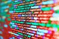 Php code on blue background in code editor. Minificated web development javascript code close up in sunset rays. Web server data Royalty Free Stock Photo