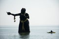 Phra apai mani and mermaid and demons statue in the sae at Puktien Beach