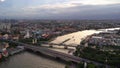 Phra Phuttha Yodfa Bridge, Memorial Bridge with buildings at Chao Phraya River. Bangkok at sunset, Thailand. 4K cityscape VDO.