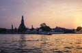 Phra Prang Wat Arun, The beautiful temple along the Chao Phraya river at sunset in Bangkok, Thailand Royalty Free Stock Photo