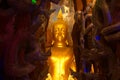 Phra Rattana Mahabadan and the guardian serpent in the Naga cave at Wat Maniwong Temple.