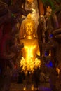 Phra Rattana Mahabadan and the guardian serpent in the Naga cave at Wat Maniwong Temple.