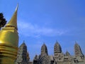 The Phra Si Rattana Chedi is a traditional stupa and covered with gold mosaic tiles