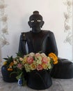 Phra Upakut sculpture in black colour
