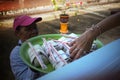 Phrae , Thailand : September 13 2019 : The vendor on the Thai train sell Red pork noodles at Ban Pin Railway Station