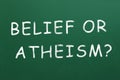 Phrase Belief Or Atheism? written on green chalkboard