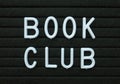 The phrase Book Club in white text on a letter board