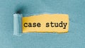 The phrase Case Study appears on yellow background under torn blue paper Royalty Free Stock Photo