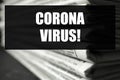 Phrase Corona Virus and stack of newspapers. Journalist`s work Royalty Free Stock Photo