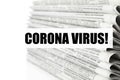 Phrase Corona Virus and stack of newspapers on background, closeup. Journalist`s work Royalty Free Stock Photo