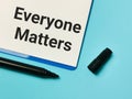 Phrase EVERYONE MATTERS written on paper clipboard