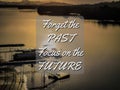 Phrase forget the past focus on the future with blurry background.