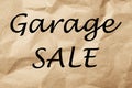 Phrase GARAGE SALE written on crumpled paper