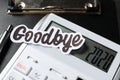 Phrase Goodbye 2020 formed of word cut from paper and digits on calculator screen