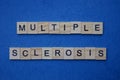 Phrase from gray words multiple sclerosis from small wooden letters