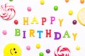 The phrase happy birthday, lollipops, candy smile on, are scattered around the colorful jelly beans