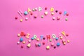 Phrase HAPPY BIRTHDAY made of candles and candies on color background Royalty Free Stock Photo