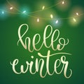 Phrase Hello Winter on green Christmas backround