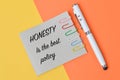 Phrase HONESTY IS THE BEST POLICY written on memo note