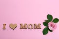 Phrase I LOVE MOM made of wooden letters with heart Royalty Free Stock Photo