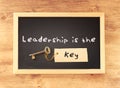 The phrase - leadership is the key written on blackboard.