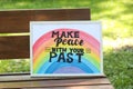 Phrase Make Peace With Your Past written on poster outdoors