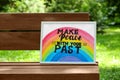 Phrase Make Peace With Your Past written on poster outdoors