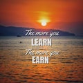 Phrase the more you learn the more you earn with sunset Royalty Free Stock Photo
