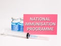 Phrase NATIONAL IMMUNISATION PROGRAMME written on red card