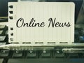 Phrase Online News written on a piece of paper