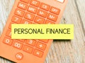 Phrase PERSONAL FINANCE written on sticky note with calculator. Royalty Free Stock Photo