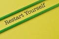 Phrase RESTART YOURSELF isolated on yellow background