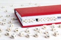 Phrase Risk factory written in wooden blocks in red notebook on