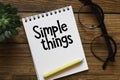 The phrase Simple Things written by hand on a notepad Royalty Free Stock Photo