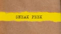 The phrase Sneak Peek appearing behind torn brown paper