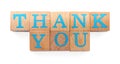 Phrase Thank You made of wooden cubes with letters on white background, top view Royalty Free Stock Photo