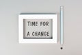 The phrase time for a change is standing in the frame, starting a new business or education goal, positive motivation and coaching