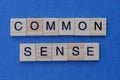 Phrase of two gray words common sense of small wooden letters