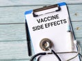 Phrase VACCINE SIDE EFFECTS written on paper clipboard Royalty Free Stock Photo