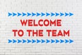 Phrase Welcome to the team on brick wall