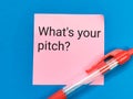 Phrase what is your pitch written on sticky note with a pen.