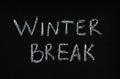 Phrase Winter Break written on black chalkboard. Holidays concept Royalty Free Stock Photo