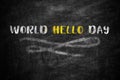 Phrase World Hello Day written on black chalkboard