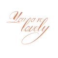 The phrase you are lovely. One word. Calligraphy Copperplate text.