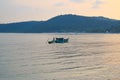 Phu Quoc, Vietnam - December 2018: vietnamese fisherman is in the his small green home boat. Royalty Free Stock Photo