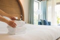 PHU QUOC, VIETNAM JUNE 28, 2017: Cropped image of a female chambermaid making bed in hotel room Royalty Free Stock Photo