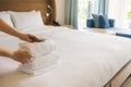 PHU QUOC, VIETNAM JUNE 28, 2017: Cropped image of a female chambermaid making bed in hotel room Royalty Free Stock Photo