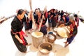 Phu Thai minority woman pounding and winnowing rice.